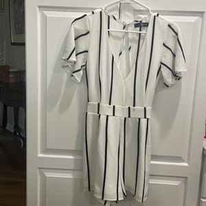 Black and White Stripe size 7 romper- fits like 2/4 - back out tie in back